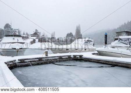 Snow And Ice Covered Boats At Pedder Bay Marina On Vancouver Island, British Columbia, Canada