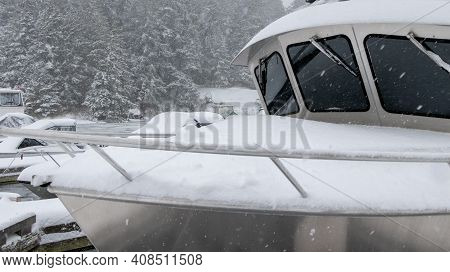 Fishing Boat Covered In Snow At Pedder Bay Marina On Vancouver Island, British Columbia, Canada