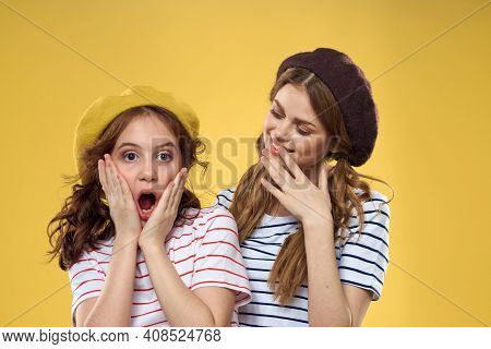 Mom And Daughter Embrace Joy Fun Childhood Lifestyle Yellow Background