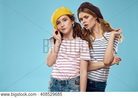 Fashion Sisters In Hats Fun Lifestyle Blue Background Studio