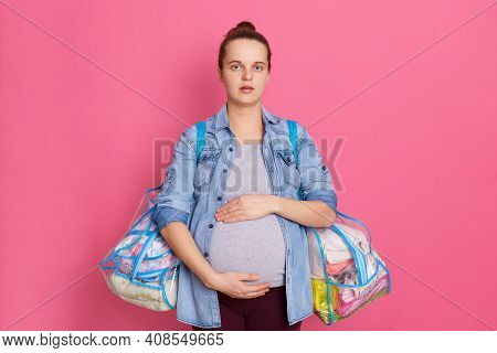 Upset Pregnant Woman Anticipates Child, Holds Baby And Her Stuff For Maternity House In Bags, Wears 