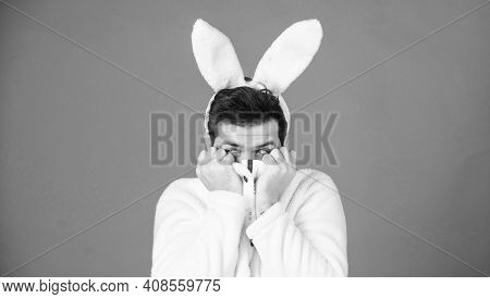White Bunny Symbol Of Easter Holiday. Soft And Tender. Guy With Long Bunny Or Rabbit Ears On Violet 