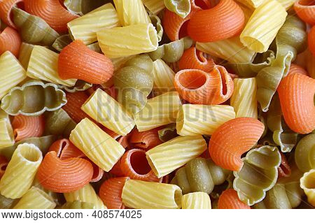 Top View Of  Adorable Shapes Of Three-color Uncooked Vegeroni Pasta