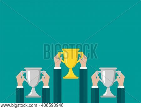 Hands With Gold Trophy, Winning Cup Isolated On Blue Background. First Place, Award Bowl. Symbol Of 
