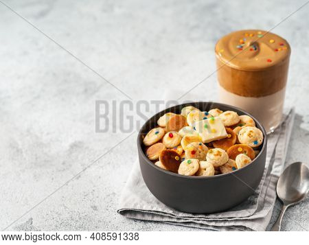 Mini Pancakes Cereal And Dalgona Coffee On Gray Cement Background, Copy Space. Trendy Food And Drink