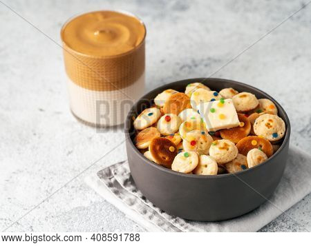 Mini Pancakes Cereal And Dalgona Coffee On Gray Cement Background, Copy Space. Trendy Food And Drink