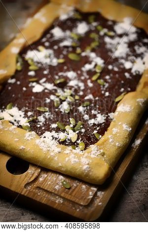 Homemade Square Galette With Confiture And Pumpkin Seeds.