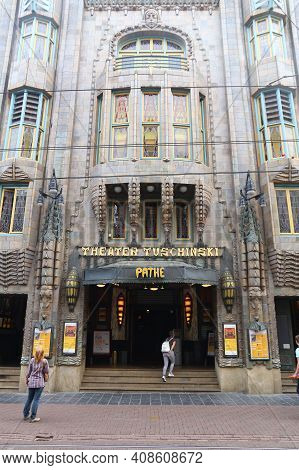 Amsterdam, Netherlands - July 10, 2017: People Walk By Movie Theater Pathe Tuschinski In Amsterdam. 