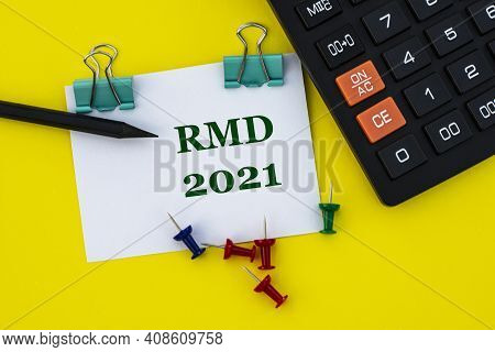 Rmd (required Minimum Distribution) - Acronym On A White Sheet With Clips On A Yellow Background Wit