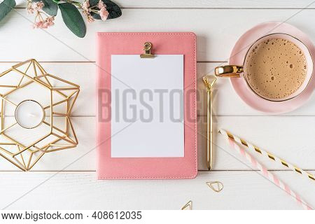 Top View Of White Working Table Background With Blank Paper Notebook, Cup Of Coffee. Flat Lay Green 