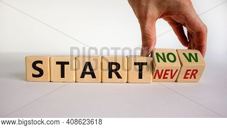 Start Now Or Never Symbol. Businessman Turns Wooden Cubes And Changes Words 'start Never' To 'start 