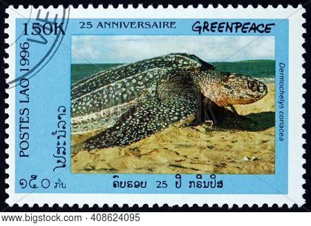 Laos - Circa 1996: A Stamp Printed In Laos Shows Leatherback Sea Turtle On Sand, Dermochelys Coriace