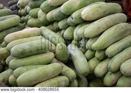 Fresh Green Tropical Fruit, Vegetables That Looks Like Zucchini And Squash At A Local Street Market 