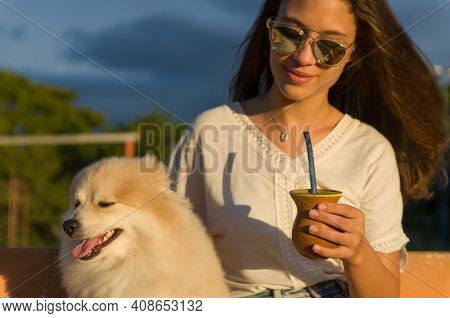 Blonde Woman Taking Traditional Gaucho Chimarrao