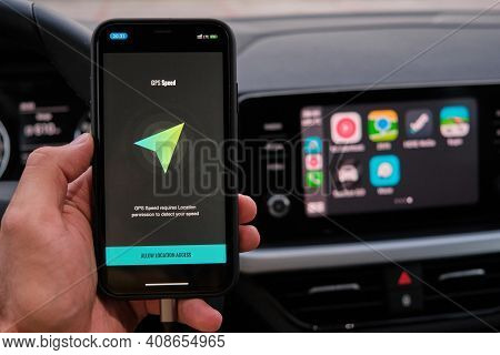 Gps Speed Logo On The Screen Of Smart Phone In Mans Hand On The Background Of Car Dashboard Screen W