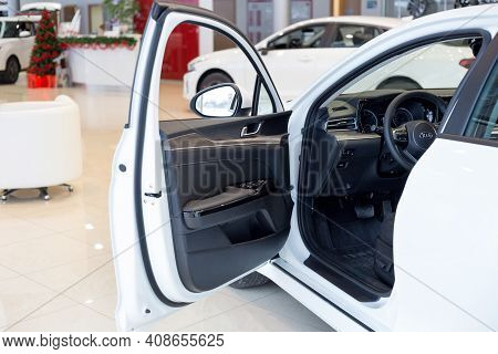 Russia, Izhevsk - December 28, 2020: Kia Showroom. Interior Of New K5 Car With Opened Car Door. Famo