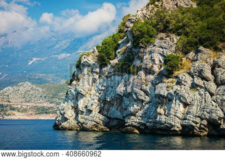 View On Grey Rock Islend In The Sea. Budva Riviera, Montenegro
