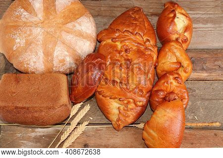 Homemade Pies With Toppings, Bread On An Old Wooden Table, Healthy And Natural Food Concept, Traditi