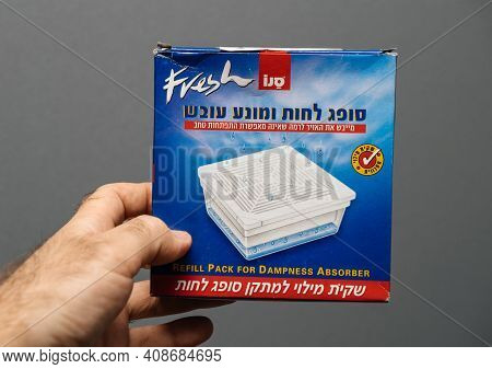 Paris, France - May 3, 2020: Pov Male Hand Holding Package With Dampness Absorber Refill Pack Manufa