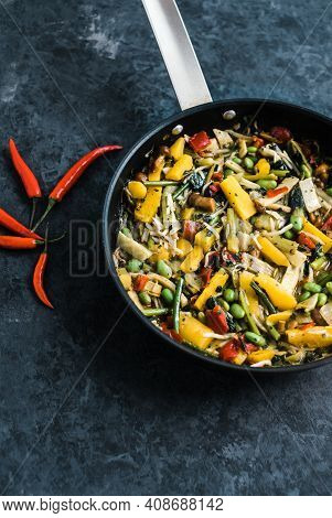 Fresh Asian Vegetables Mix, Thai Wok In A Black Pan On The Black Background With Copy Space. Healthy