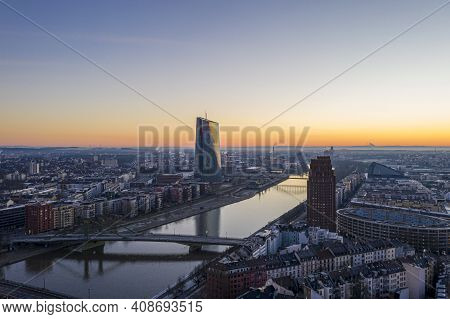 View Over River Main In Frankfurt With Floesser Bridge And European Central Bank Building With Sun R