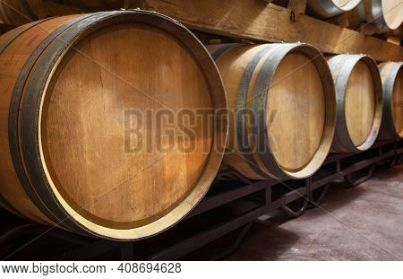Cellar With Barrels Of Wine. High Quality Photo