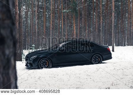 Kherson, Ukraine - February 2021. Powerful Mercedes-amg E63s Brabus 800 In A Black Color In The Wint