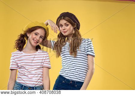 Funny Mom And Daughter Wearing Hats Fashion Fun Joy Family Yellow Background