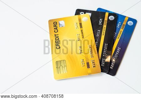 Close Up Of A Set Of Cradit Cards Isolated On White Background. Credit Card Lets Cardholders Borrow 