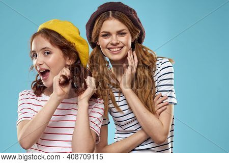 Mom And Daughter Striped T-shirts Hugs Fun Lifestyle Blue Background