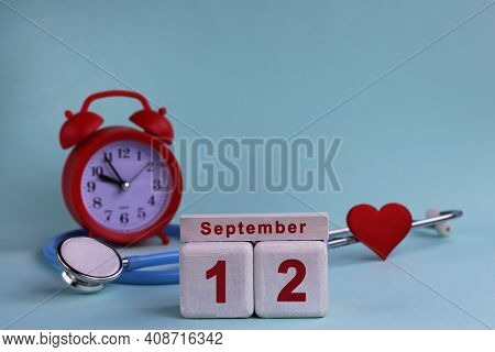 September 12. Day 12th Of Month, Calendar Date White Wooden Calendar Blocks With Date, Clock And Ste