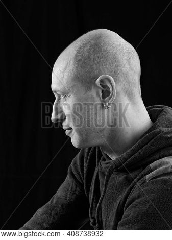 Bw Portrait Of A Bald Man On A Black Background