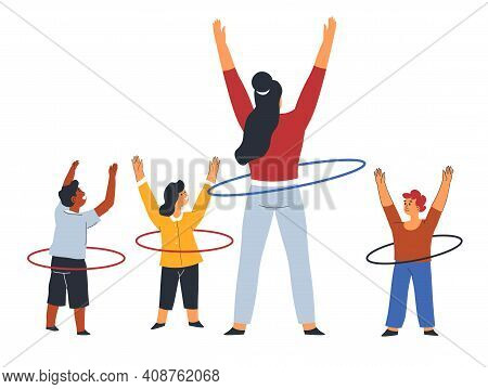 Teacher And Children With Hulahoop At Pe Lesson