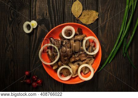 Suillus Luteus Or Boletus Luteus Mushrooms Marinated In A Plate With Spices And Onions On A Vintage 