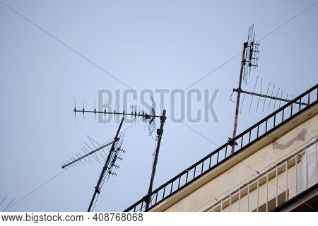 Television Antennas,  Vhf And Uhf Frequencies, At The Top Of A European Roof. Vhf And Uhf Are Two Of