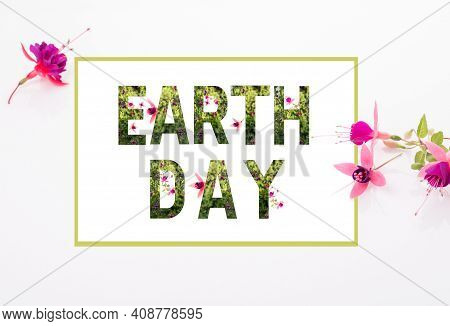 World Earth Day Concept. Lettering Earth Day With Plants And Wonderful Flowers