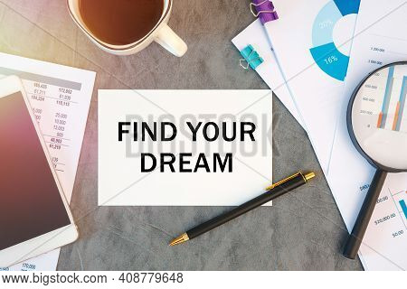 Find Your Dream Is Written In A Document On The Office Desk With Office Accessories, Coffee, Diagram