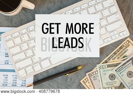 Get More Leads Is Written In A Document On The Office Desk With Office Accessories, Coffee, Money An