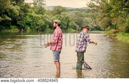 Get Hobby. Hobby And Sport Activity. Trout Bait. Male Friendship. Family Bonding. Two Happy Fisherma