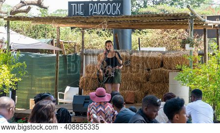 Johannesburg, South Africa - October 2019: Performer Singing On Stage In Fourways Farmers Market Wit