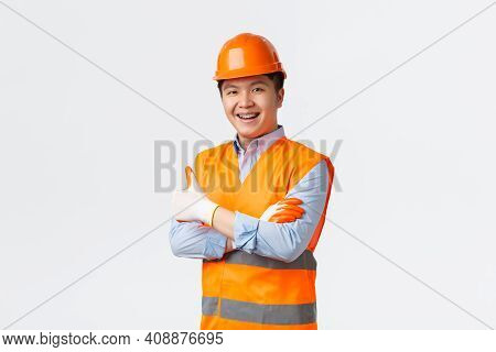 Building Sector And Industrial Workers Concept. Confident Young Asian Engineer, Construction Manager