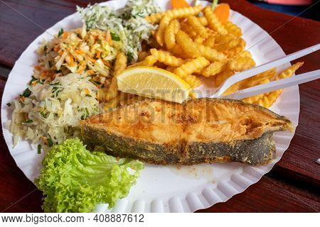 Fried Fish With Fries And Vegetable Salad