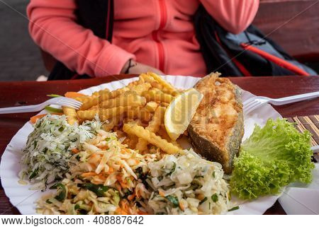 Fried Fish With Fries And Vegetable Salad