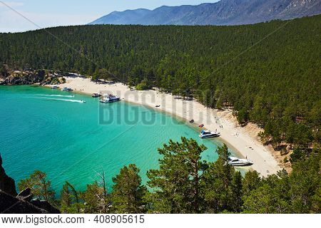 The Beautiful Sandy Beach On Summer Sunny Day. Lake Baikal, The Sandy Bay. Yachts Near The Shore, To