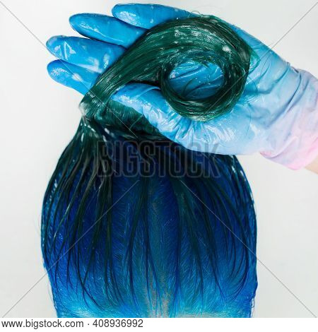 Washing Of Woman Hair With Conditioner Shampoo In Sink With Special Shower. High-angle Shot Of Beaut
