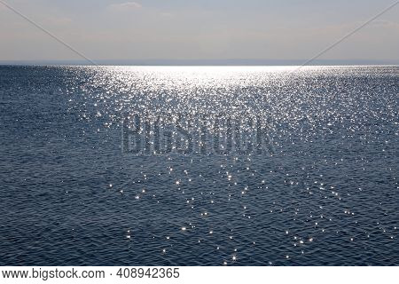 Panorama Of Lake Balaton Hungary Silvery Glittering Water With View Of Far Mountains Range And White