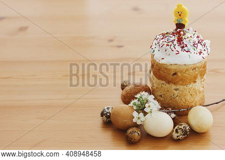 Delicious Homemade Easter Bread, Stylish Easter Eggs, Blooming Spring Flowers On Rustic Table. Happy