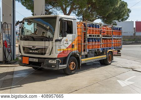 Campos, Spain; February 18 2021: Repsol Butane Cylinders Truck Parked At A Gas Station On A Sunny Da