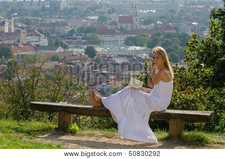 young woman reading book in Vilnius, Lithuania