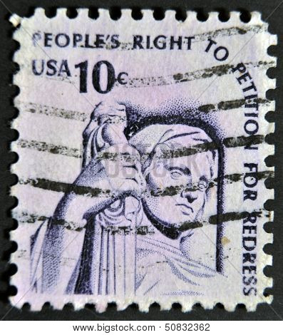 A stamp printed in the USA shows Contemplation of Justice (statue J. E. Fraser)